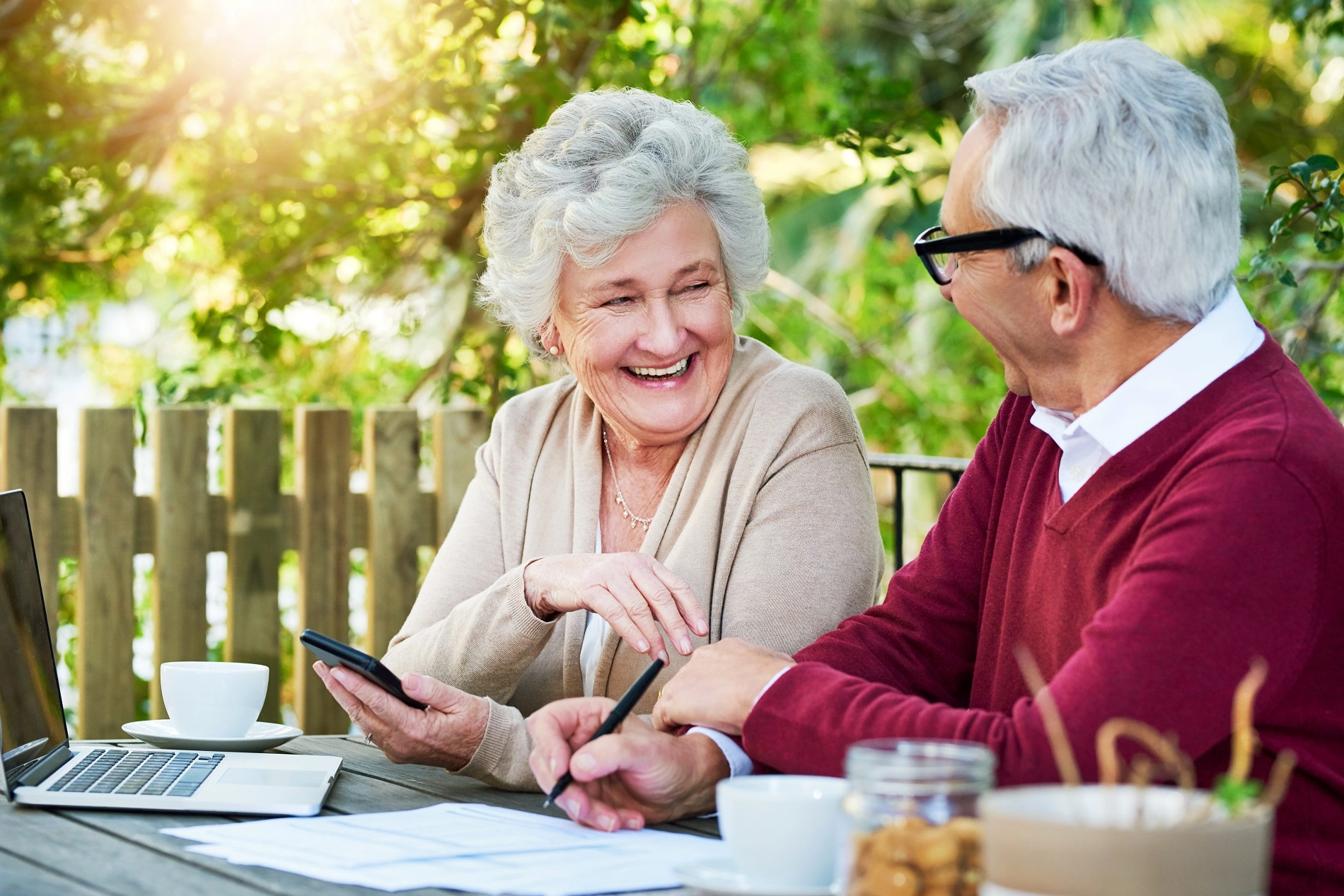 Caregiver assisting elderly couple with personal care at home in Atlanta Georgia