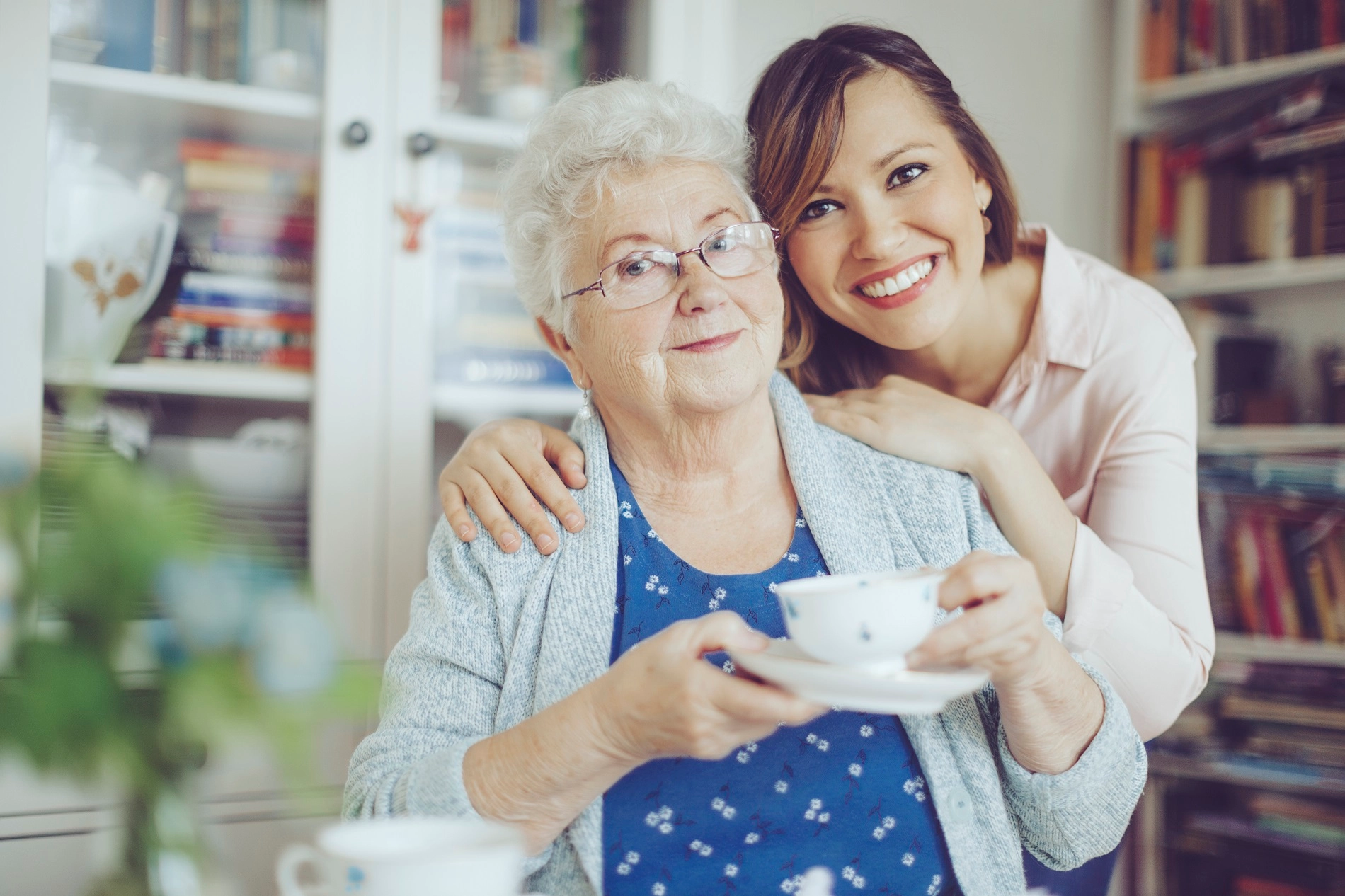 Caregiver assisting elderly woman at home in Atlanta Georgia